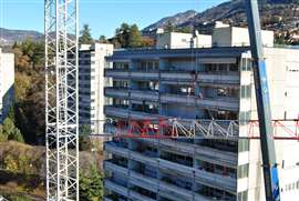 one of three Terex CTT 202-10 flat top tower cranes on the towers of Trento site in Italy