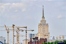 High rise construction cranes background Stalin high rise in Moscow