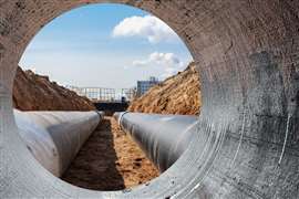 Modern water supply and sewerage system. Underground pipeline works. Water supply and wastewater disposal of a residential city. Close-up of underground utilities.