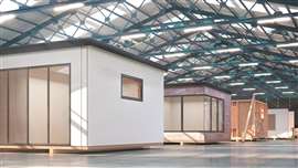 A warehouse stores modular homes