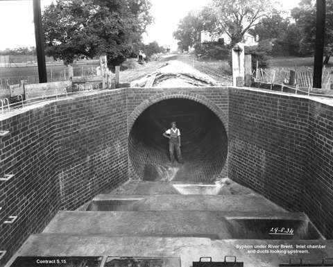 man standing in mogden tunnel 1930
