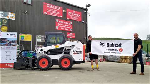 Team at Bobcat dealership holds Bobcat Certified banner