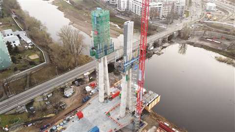 Construction of a single-span pylon bridge over the Alte Elbe river in Magdeburg, Germany.