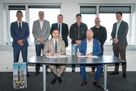 Port authorities and the team from Liebherr signing deal for new crane purchase